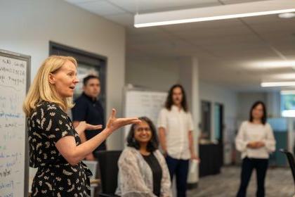 On the right, Leslie Bayers participates in a Faculty Fellows program meeting.